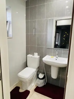 a bathroom with a toilet and a sink at New studio in Jabal Amman and Al-Weibdeh متابعة in Amman