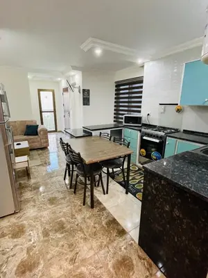 a kitchen with a table and chairs in a room at New studio in Jabal Amman and Al-Weibdeh متابعة in Amman