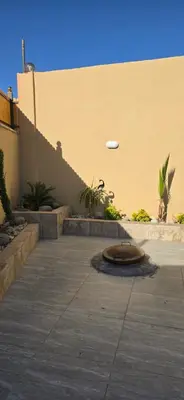a frisbee flying through the air over a patio at شاليه المهرة in Murayjimat Ibn Ḩāmid