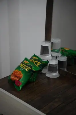 a counter with some snacks and cups on it at Petra Visitor Center Apartment in Petra