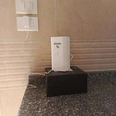 a wii game system sitting on a black stand at ابو عبدالله للشقق الفندقيه in Ajloun