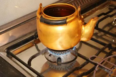 a tea pot sitting on top of a stove at PetraEcho lodge Section B Home in Wadi Musa