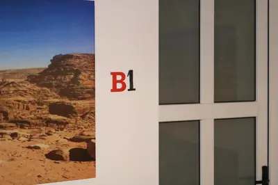 a door with the letter b on the side of a building at PetraEcho lodge Section B Home in Wadi Musa