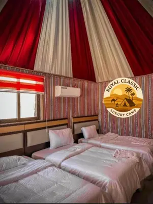 two beds in a room with a circus tent at RUM ROYAL CLASSIC lUXURY CAMP in Disah
