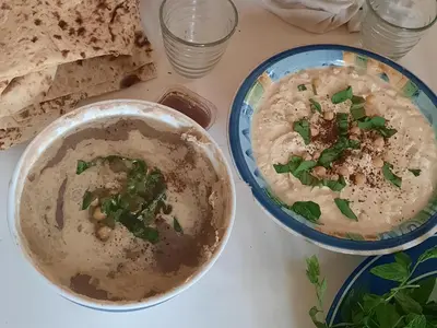 a bowl of soup sitting on top of a table at استراحة الباشا albash farm stay in Al Karāmah