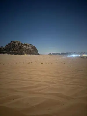 a view of a sandy beach at night at Ayloulcamp in Disah