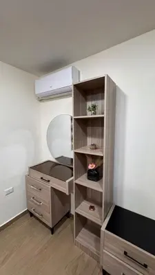 a dressing room with a mirror and a dresser at شقة مفروشة apartment amman alnuzzha in Amman