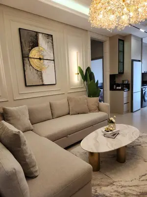 a living room with a couch and a table at كمباوند المطار شقه مفروشة in Amman