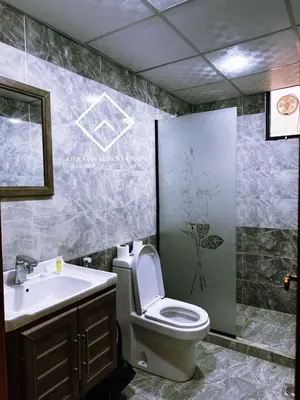 a bathroom with a toilet and a sink at ALYA RUM LUXURY Camp in Wadi Rum