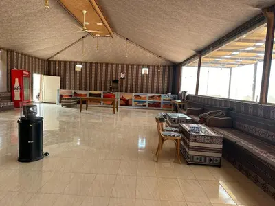 a large room with a table and chairs in it at Rum Magic Bubbles in Wadi Rum