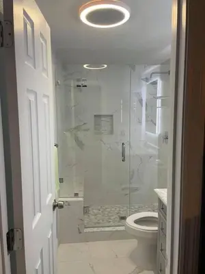 a bathroom with a glass shower with a toilet at Moon Red Bubbles Camp in Wadi Rum