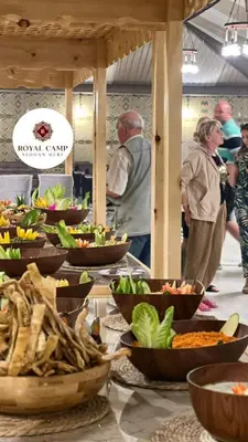a buffet with many bowls of food on a table at Thirteen Luxury Camp Valley in Wadi Rum