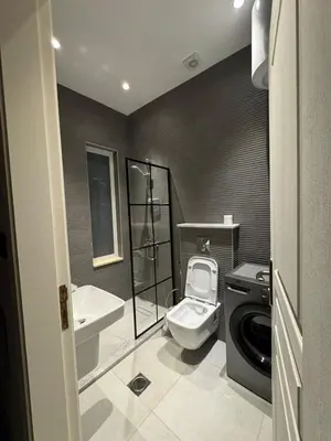 a bathroom with a toilet and a sink at Roof 99 in Amman