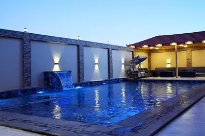 a swimming pool in the middle of a building at For daily, weekly monthly and yearly stays in Amman