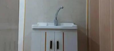 a bathroom sink with a faucet on top of it at Stone house in Amman
