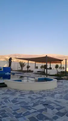 a white boat sitting in the water with a canopy at Rest Sea Chalet Private Room
