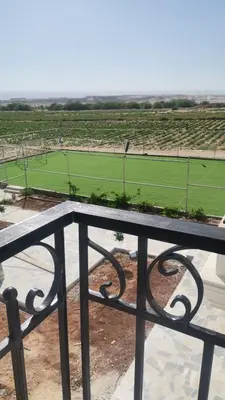 a view of a tennis court from a balcony at Rest Sea Chalet Private Room