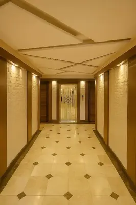 a hallway of a building with a tile floor at Central Amman Twin Towers Apartment 2 in Amman