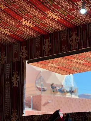 a close up of a wooden wall with a window at BUBBLE lUXURY RUM JNOPE CAMP in Wadi Rum