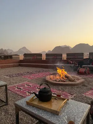 a fire pit with a pot on a table at Desert soul in Wadi Rum