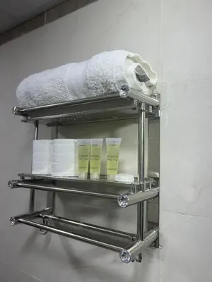 a towel rack in a bathroom with towels at Sunrise Echo Camp in Wadi Rum