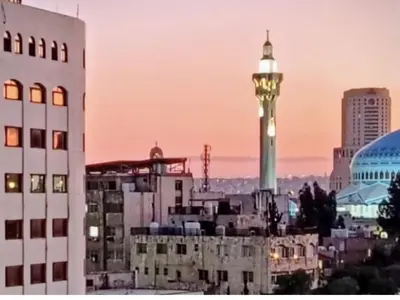 a view of a city skyline with a clock tower at small house in Amman