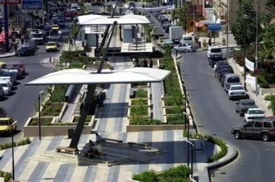 a view of a street with cars parked on the road at Le Shot tours Hotel in Al Jafr