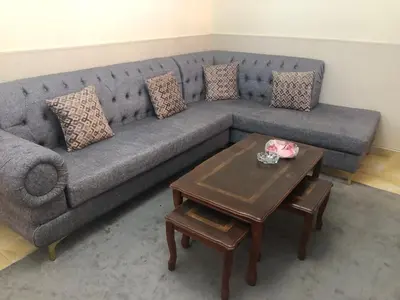 a living room with a couch and a coffee table at Irbid in Irbid