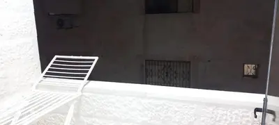 a white chair sitting on top of a building at غزو 15 in Irbid