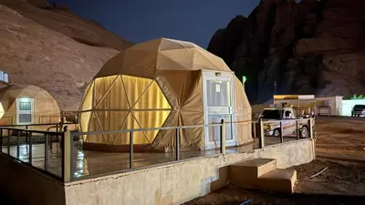 a luxury yurt in a desert at night at HAGIA SOPHIA lUXURY CAMP in Disah