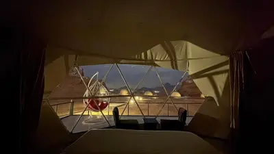 a view from inside of a tent with a plane at HAGIA SOPHIA lUXURY CAMP in Disah