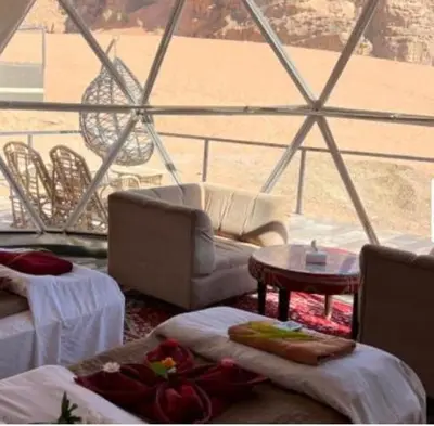a living room with a view of the ocean from a ship at Wadi Rum Salem in Wadi Rum