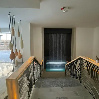 a swimming pool in the middle of a room at Crystal Collection Hotel in Amman