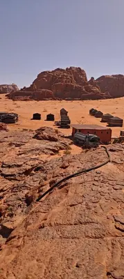 a train on the tracks in the desert at Bedouin Horizons in Wadi Rum