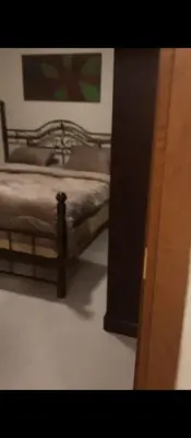 a bedroom with a bed and a painting on the wall at عمان شارع مكه in Amman