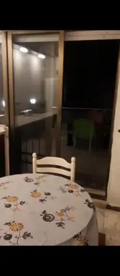 a dining room table with a flower patterned table cloth at عمان شارع مكه in Amman