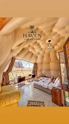 a room with a bed in a large room at Haven Luxury Camp in Aqaba