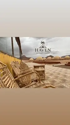a group of chairs sitting on top of a beach at Haven Luxury Camp in Aqaba
