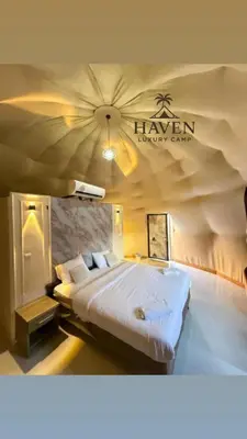 a bedroom with a large bed in a tent at Haven Luxury Camp in Aqaba