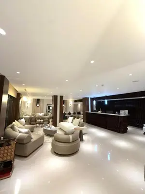 a large living room with couches and a piano at AL Hyatt Relax Hotel in Aqaba