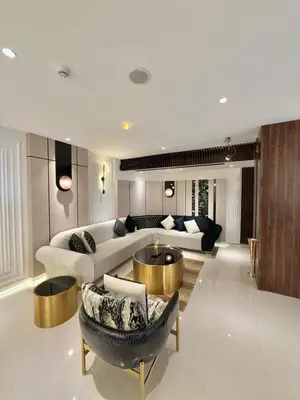 a living room with a couch and a table at AL Hyatt Relax Hotel in Aqaba