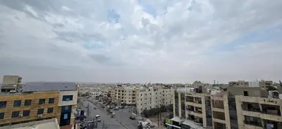 an overhead view of a city with buildings at Irbid irbid alrazi st in Irbid