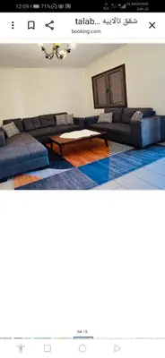 a living room with couches and a coffee table at jordanseatoursCom in Aqaba