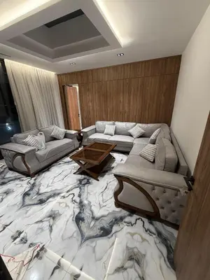 a living room with a large marble floor at Alma chalets in Aş Şarīḩ