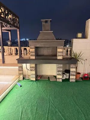 a building with a green floor on a roof at RoofTOP SPORTCITY in Amman