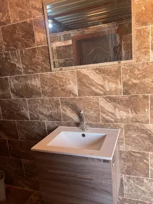 a bathroom with a sink and a mirror at Wadi Rum Bedoun in Wadi Rum