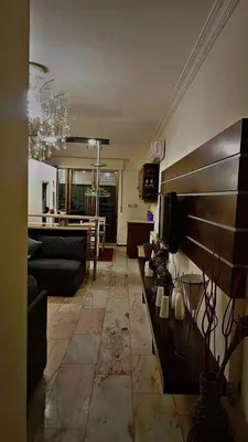 a living room with a couch and a table at ضاحيه الأمير راشد in Amman