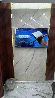 a glass door of a bathroom with a book on the counter at Nadina Bedouin home in Petra