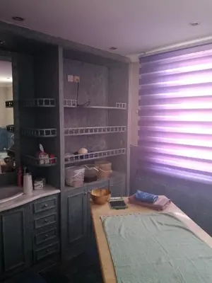 a kitchen with a sink and a window with blinds at Power Stay Hotel in Amman