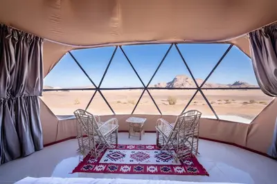 a room with a view of the desert from a tent at Ahmad Wadi Rum Camp in Wadi Rum